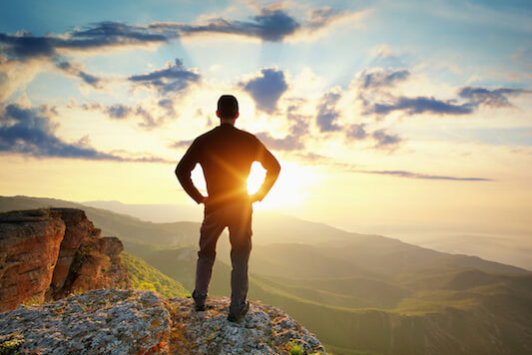 Man on top of mountain. Conceptual scene.